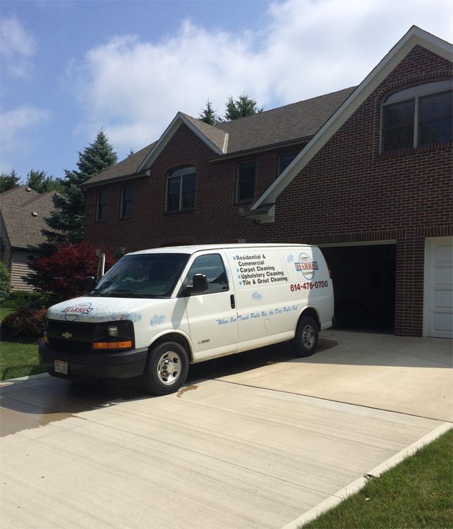 carpet cleaning van in driveway